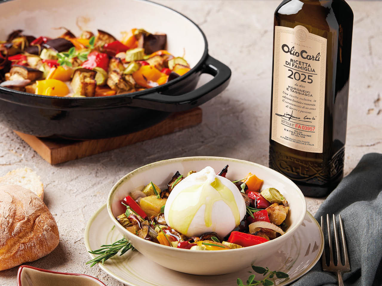 Olivenöl Ricetta di Famiglia auf Mozzarella und Gemüse